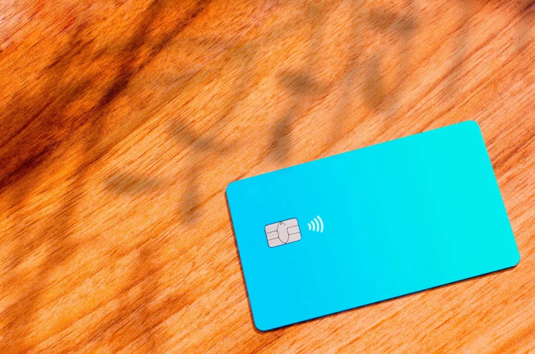 A Self Visa Secured Credit Card on the table.
