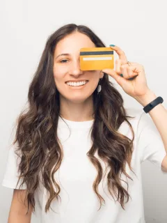 A woman using her Petal 2 Visa Credit Card.