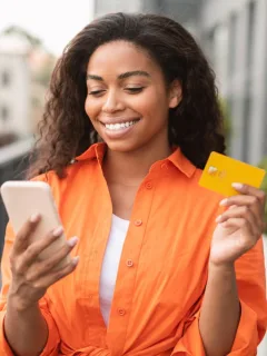 A woman holding her Wells Fargo Health Advantage.