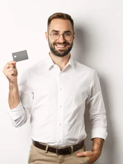 A man holding a Simmons Visa Credit Card.