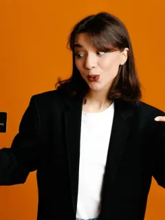 A girl holding her Bilt Mastercard