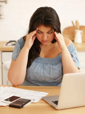 A girl trying to paying off debt.