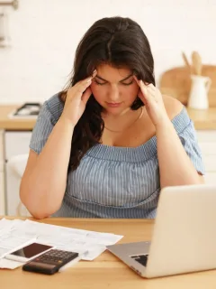 A girl trying to paying off debt.
