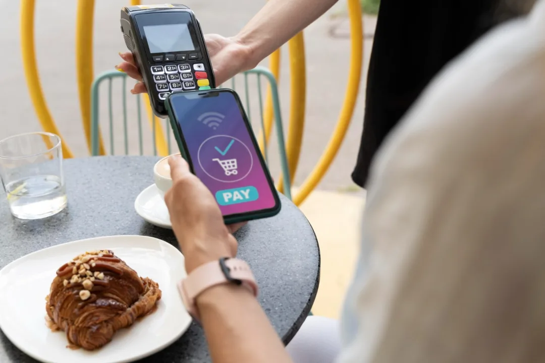 A person using Contactless payments.
