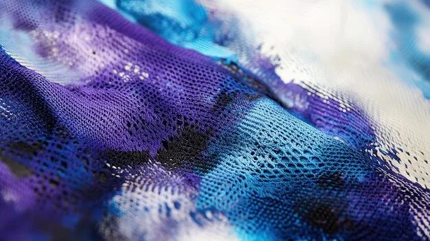 A close-up, abstract shot of various high-tech performance fabrics, showing their intricate weaves and textures, perhaps under a microscope to emphasize their engineered properties. Colors could be muted or futuristic to highlight innovation.