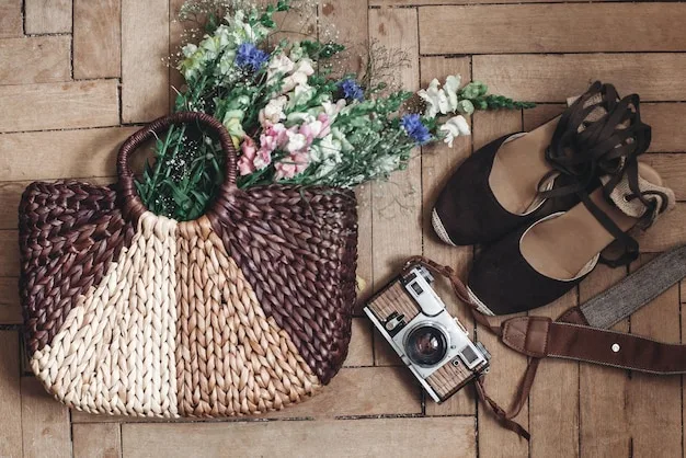 A flat lay of cottagecore accessories: a straw hat, a woven basket bag, a pair of leather sandals, and a small wildflower bouquet.