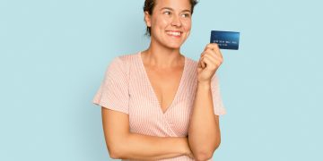 A woman with her Citi Custom Cash Credit Card.