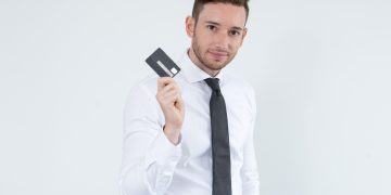 A man holding a Citi Premier Card.