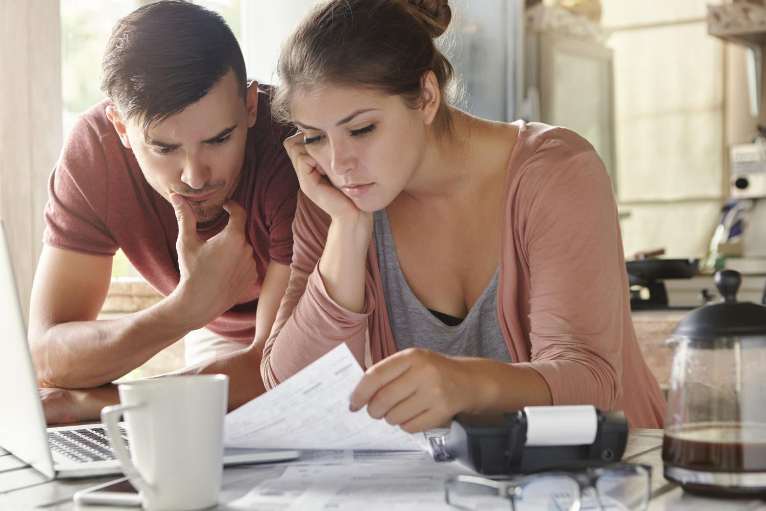 couple planning how to reduce monthly bills