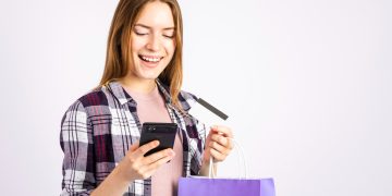 Woman using AliExpress Discount Coupons.