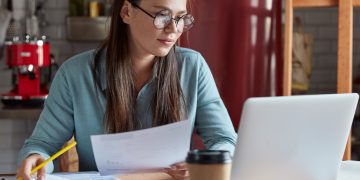 Woman learning How to find a checking account.