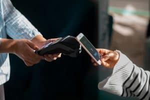 A person using Contactless payments. 