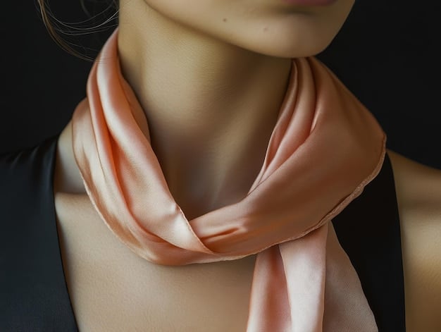 A close-up shot of a silk scarf tied elegantly around a woman's neck, with a subtle pattern and rich colors. Her outfit is simple, allowing the scarf to be the main focus.