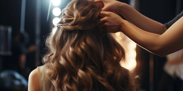 A woman gently brushing her long, flowing hair extensions with a specialized loop brush. Her hair is shiny and well-maintained, indicating proper care. The background is a soft, blurred home bathroom setting.