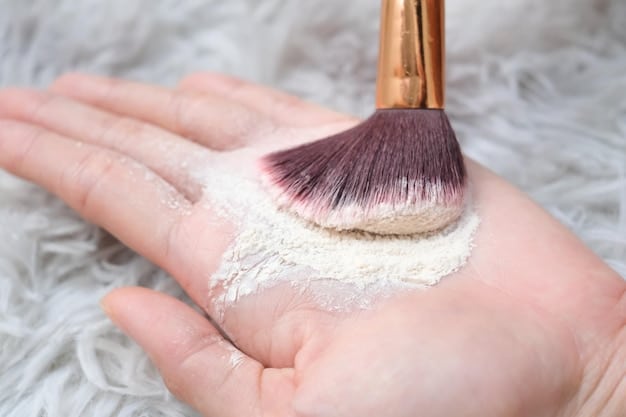 A hand holding a powder brush delicately applying translucent setting powder onto a model's face, illustrating technique and product application.
