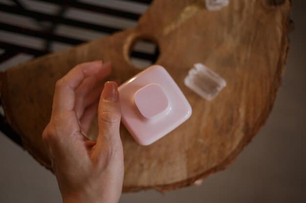 A hand applying a solid perfume balm from a compact case, illustrating convenience and subtle application.