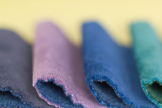 A vibrant, yet harmoniously balanced color palette displayed on everyday fabrics like denim, cotton, and linen, showing how runway color trends can be adapted for accessible clothing items. Perhaps a close-up of a textile with a subtle, abstract pattern.