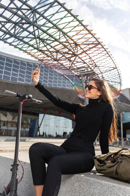 A detailed shot of flexible solar panels woven into the fabric of a chic backpack, highlighting sustainable tech integration in everyday accessories worn by a person walking in a sunny urban setting.