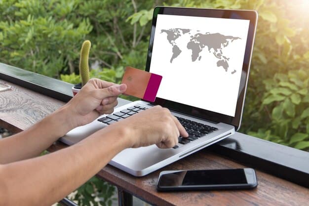 A person using a laptop to book a flight, with a credit card visible next to the keyboard, and a map of the world in the background, symbolizing online travel planning.