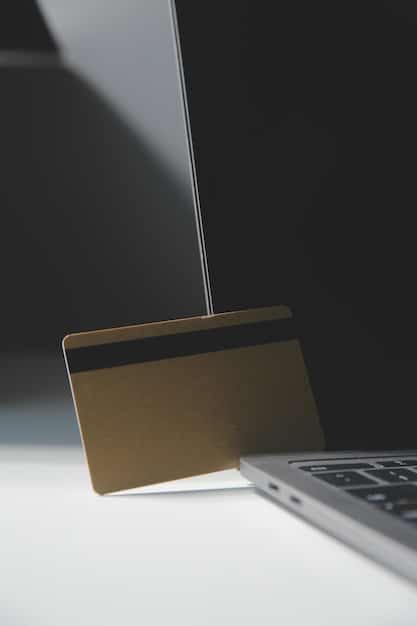 A detailed shot of an open credit card benefits guide, with a magnifying glass hovering over the 