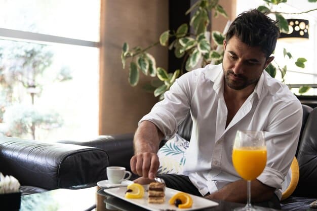 A person enjoying a complimentary breakfast in a modern hotel lounge, showcasing the tangible benefits of elite status.