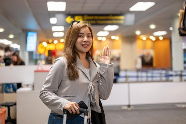 A traveler cheerfully waving their boarding pass and credit card at the airport check-in counter, where their two large suitcases are being tagged by a friendly airline agent. The scene implies a smooth, hassle-free check-in thanks to free checked bags.