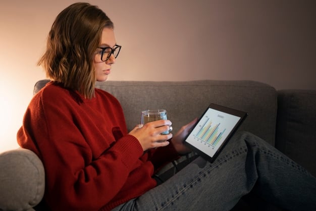 A person looking at a digital tablet with a financial app displaying reduced debt and savings graphs, symbolizing the benefits of a balance transfer. The image should convey relief and financial improvement.